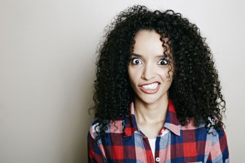 Hispanic woman making a face