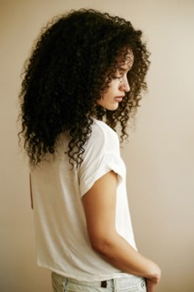 Pensive Hispanic woman looking down