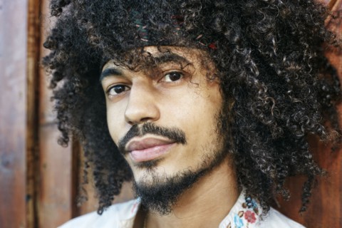 Portrait of serious Mixed Race man