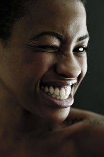 Portrait of Black woman winking