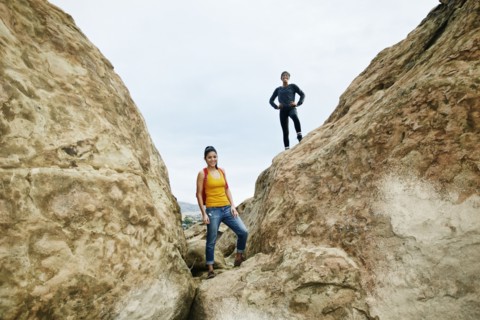 Portrait of smiling women posing on rock formation
