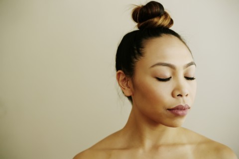 Portrait of Asian woman with eyes closed