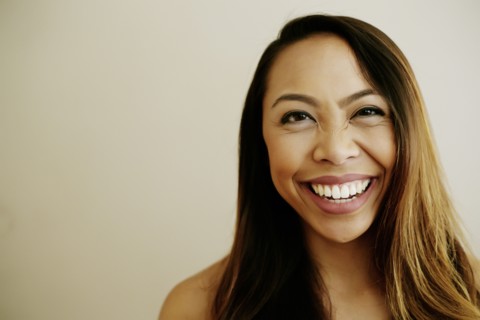 Portrait of laughing Asian woman