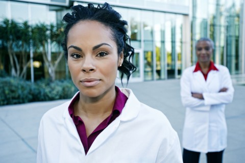 Portrait of smiling doctor outdoors at hospital