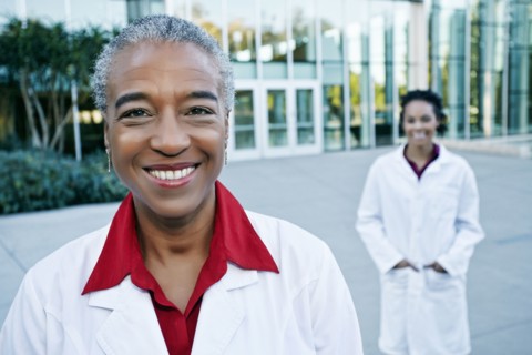 Portrait of smiling doctor outdoors at hospital