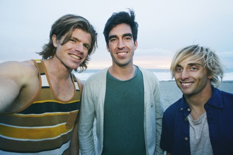 Portrait of smiling Caucasian men at beach