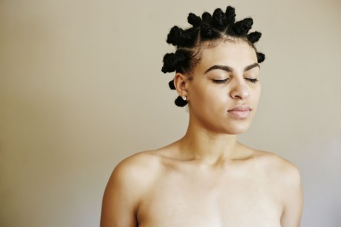 Portrait of Mixed Race woman with eyes closed