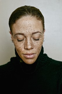 Close up of mixed race woman with eyes closed