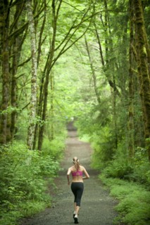 Caucasian woman running on remote path