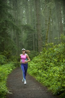 Caucasian woman running on remote path
