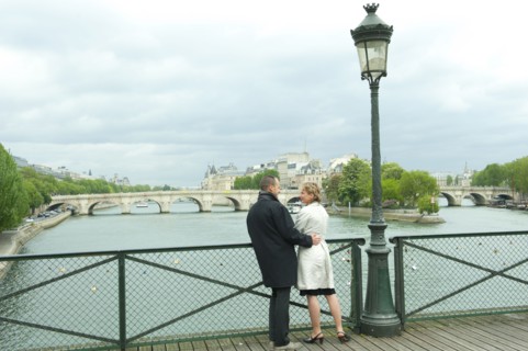 Caucasian couple talking on bridge