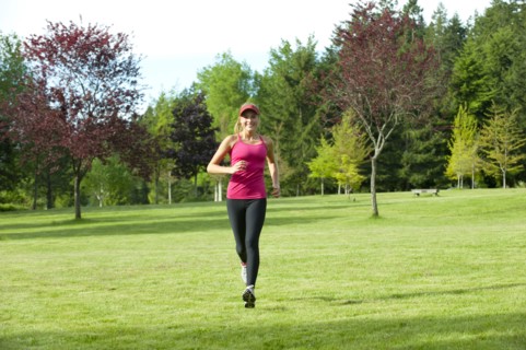 Jogger running through field