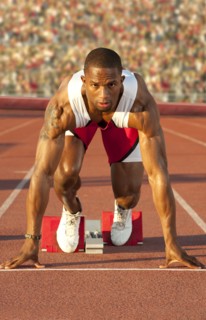 Black runner at starting block in race