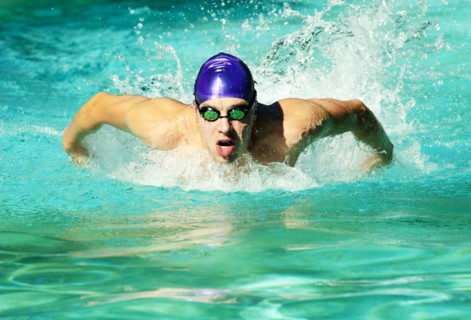 Caucasian swimmer training in swimming pool