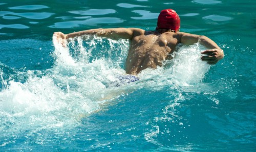 Caucasian swimmer training in swimming pool