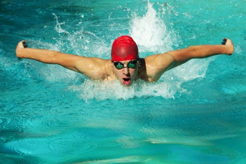 Caucasian swimmer training in swimming pool