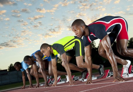 Runners preparing for race at starting blocks