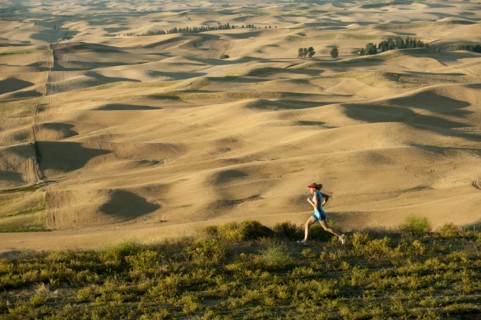 Caucasian woman running in remote area