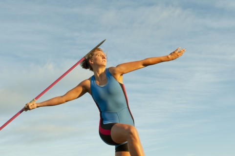Caucasian athlete aiming javelin