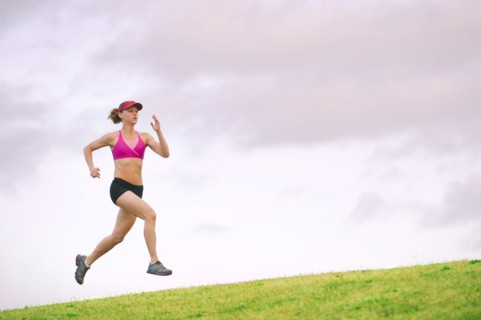 Caucasian woman running in park