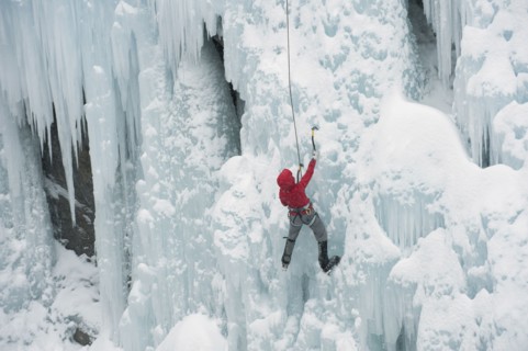 Caucasian man climbing ice