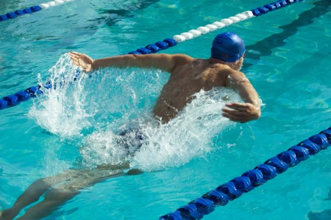 Caucasian swimmer in swimming lane