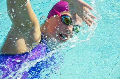 Caucasian woman swimming