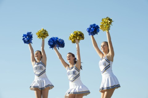 Caucasian cheerleaders posing together