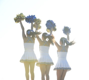 Caucasian cheerleaders posing together