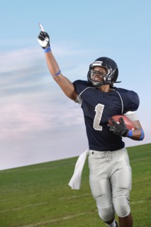 African American football player cheering in game