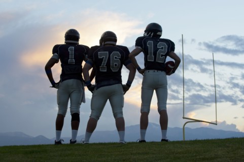 Football players standing on field