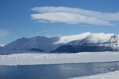 Snowy mountains overlooking arctic landscape