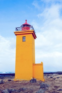 Lighthouse overlooking rocky landscape