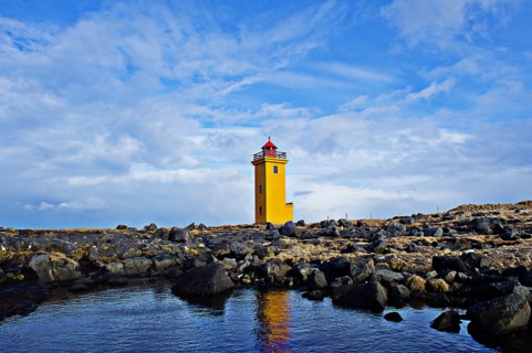 Lighthouse overlooking rocky landscape