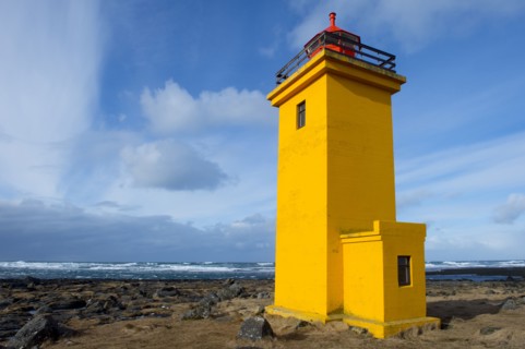 Lighthouse overlooking rocky beach