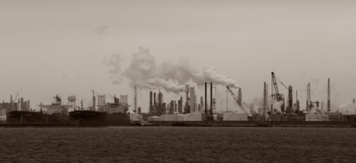 Smoke billowing from distant factory