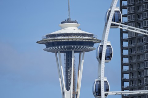 Space Needle overlooking Ferris wheel