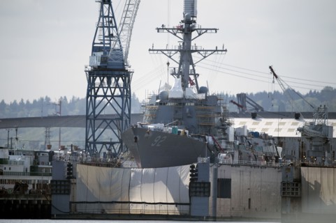Shipping cranes and ship in industrial harbor