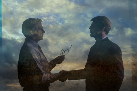 Double exposure of businessmen in clouds