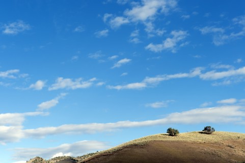 Blue sky over hill
