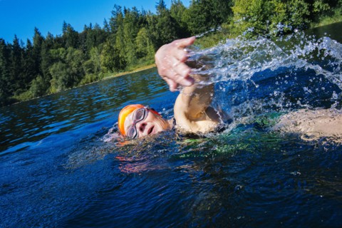 Woman swimming in lake