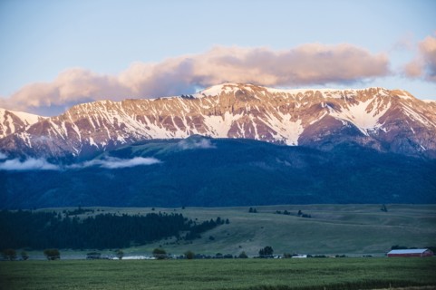 Mountains over farmlands in rural landscape