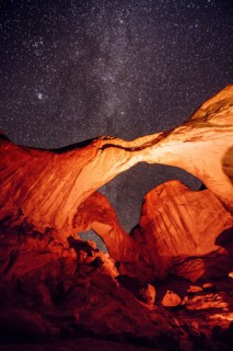 Illuminated rocks at night in Arches National Park