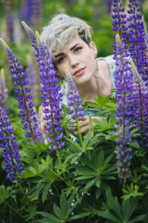 Caucasian woman in field of purple flowers