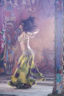Belly dancer spinning on stage