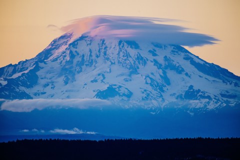 Clouds over snowy mountain