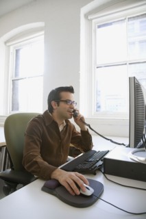 Hispanic businessman talking on telephone