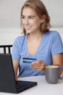 Caucasian woman shopping online with credit card