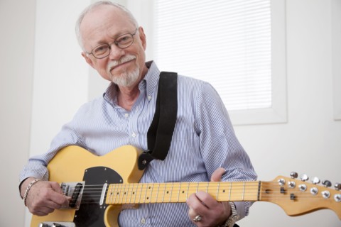 Caucasian man playing electric guitar