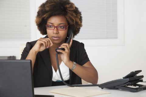 African American businesswoman working at desk